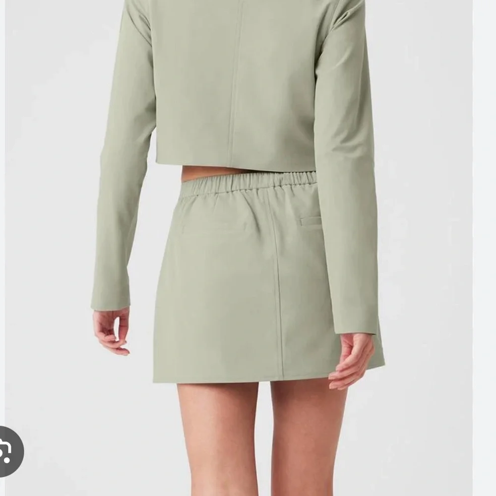 LIKE NEW ALO High Speed Mini Skirt, Limestone, size XS